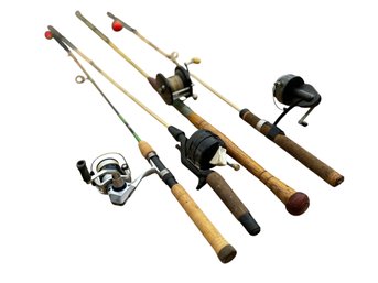 Four Vintage Fishing Rods With Reels