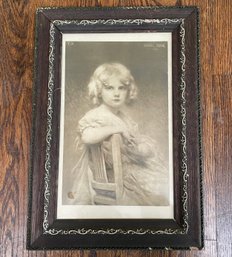 An Antique Photograph In Carved Wood Frame