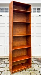 A Solid Cherry Wood Bookcase By Pottery Barn