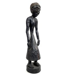 A Large West Indian Carved Wood Figural Sculpture