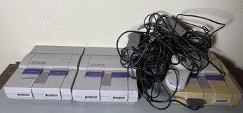TWO SUPER NINTENDO CONSOLES WITH CONTROLLERS