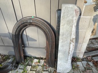 A CAST IRON FIREPLACE INSERT AND TWO MARBLE MANTLES