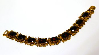 Great Vintage Signed FLORENZA Gold Tone And Dark Red Rhinestone Bracelet