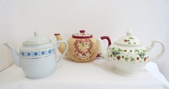 A Grouping Of 3 Ceramic Porcelain Teapots