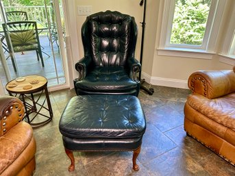 A Classic Blue Leather Arm Chair & Ottoman With Nail Head Detail