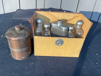 A VINTAGE TRAVEL KIT AND COPPER HUMIDOR