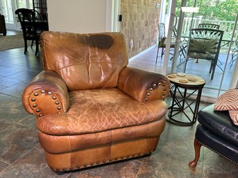 A Leather Arm Chair With Nail Head Detail & Ottoman