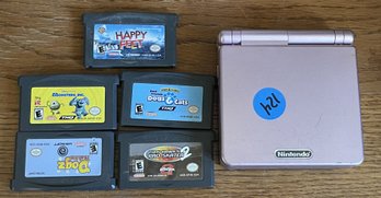 A NINTENDO GAMEBOY ADVANCE SP WITH SIX GAMEBOY ADVANCE GAMES