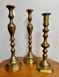 Three Very Tall Brass Candlesticks