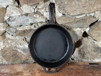 A Well-Seasoned 10' Skillet By Lodge In Cast Iron