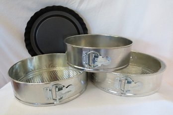 Set Of 3 Nesting Spring Form Pans And A Tart Pan