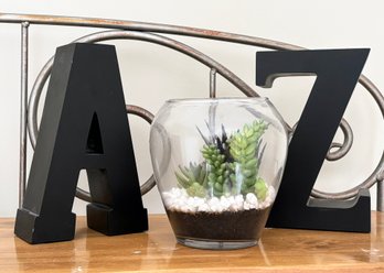 A-Z Letter Decor And A Faux Succulent Arrangement In Glass