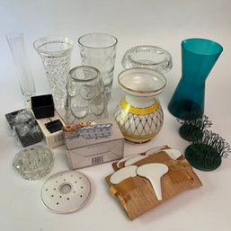 An Assortment Of Vases And Flower Arranging Items
