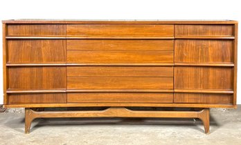 A Mid Century Modern Curved Front Sculptural Credenza In Walnut, C. 1960's By Young Manufacturing