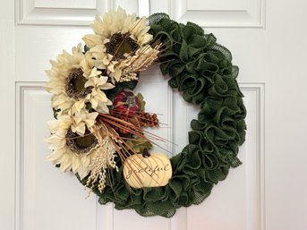 A Fall Wreath On A Green Burlap Form