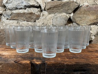 A Set Of Sixteen Fluted Glass Tumblers