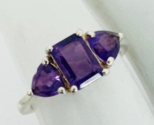 PRETTY STERLING SILVER AND AMETHYST RING