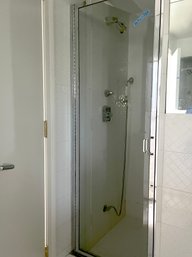 A Chrome Shower Door - Pool Bathroom