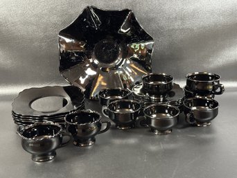 A Striking Assortment Of Vintage Dishware In Black Glass: Bowl, Plates, Cups & Saucers, More