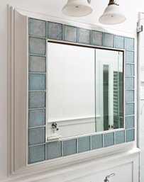 A Custom Medicine Cabinet With Glass Tile Surround And Solid Wood Trim