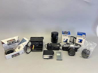 Vintage Camera Lot Including Polaroid, Yashica, Canon, And More
