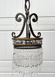 A Bronze And Crystal Tear Drop Chandelier