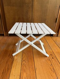 A White Wooden Folding Table