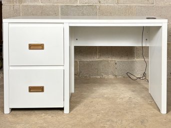 A Modern Desk With Brass Hardware