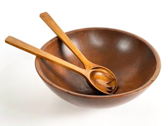 A Large Carved Wood Bowl And Utensils