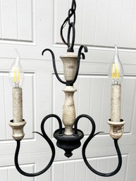 A Rustic Wrought Iron Chandelier