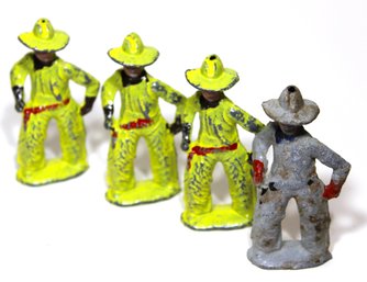 Lot Four Antique Dime Store Lead Figures Cowboys Yellow And Gray