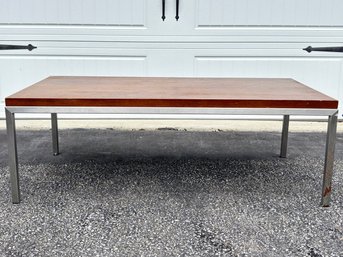 A Sleek Modern Mahogany And Chrome Coffee Table