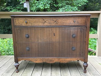 An Antique Berkey Style Walnut Three Drawer Dresser