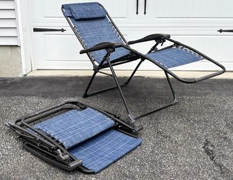 A Pair Of Folding Lawn Chairs