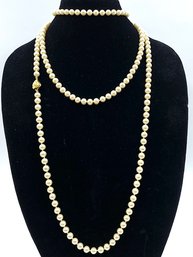 Fantastic Vintage Signed Hand Knotted Single Strand Opera Length Pearls.
