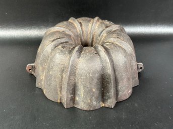 An Antique Cast-Iron Fluted Cake Pan