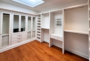 A Large Closet Of Custom Built In Cabinetry And Drawers - WOW!
