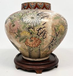 A Vintage Chinese Vase On Carved Wood Base