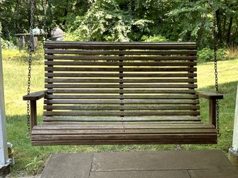 A Naturally-Weathered Wooden Slat Porch Swing