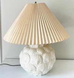 A Cast Ceramic Lamp With Shell Motif