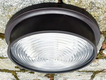 A Bronze Flush Mount Nautical Style Ceiling Fixture