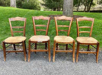 A Set Of 4 Rush Seated Oak Ladder Back Side Chairs