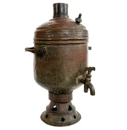 An Antique Hammered Copper Samovar