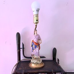 A Porcelain Figural Lamp On A Brass Base