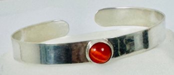 STERLING SILVER BANGLE BRACELET WITH ORANGE MOONGLOW TYPE CENTER