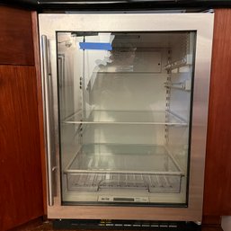 A Sub-zero Under Counter Beverage Refrigerator - Bar