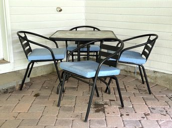 A Petite Outdoor Dining Set: Table & Four Chairs