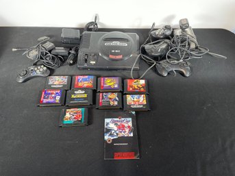SEGA GENESIS CONSOLE WITH CONTROLLERS AND LOOSE GAMES