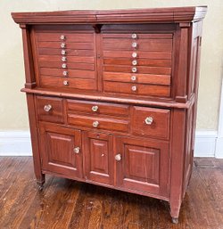 An Antique Paneled Mahogany Apothecary Or Dental Cabinet With Original Glass Knobs