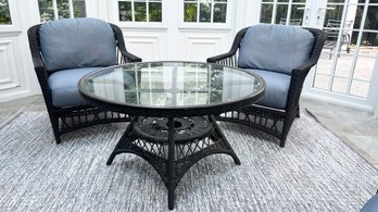 Pair Of Wicker Cushioned Arm Chairs And Matching Round Table With Glass Top